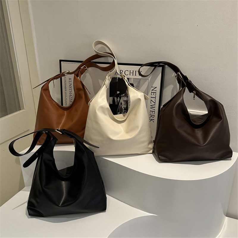 Sleek Black Leather Shoulder U - Leatherwork Workshop recension och pris